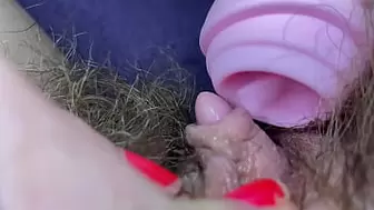 Testing Snatch licking clit licker toy enormous clitoris hairy vagina in extreme closeup masturbate