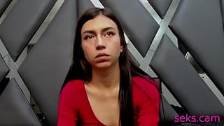 Thin brunette girl in red spreads her legs on camera